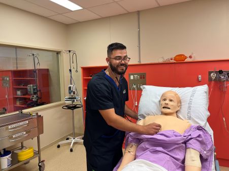 Nurse with stethoscope on practice patient